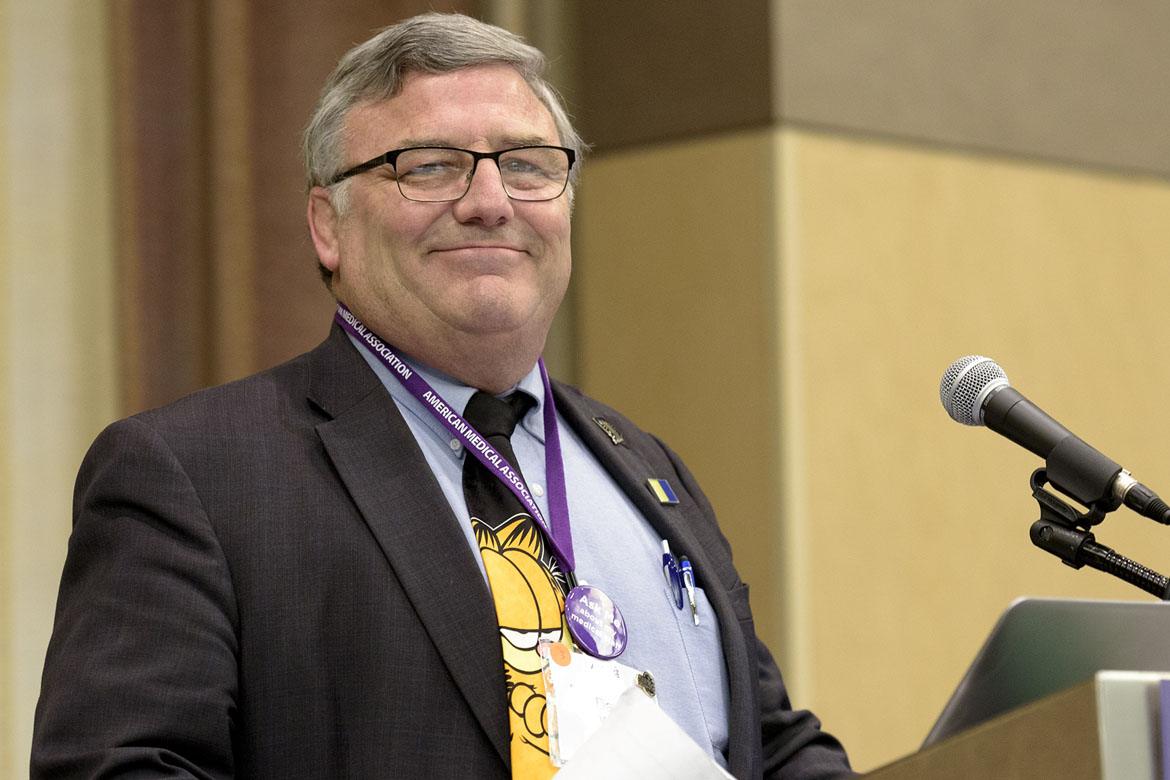 David Welsh, MD at podium