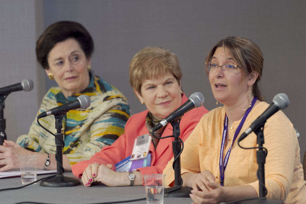 Three physicians speaking at an education session