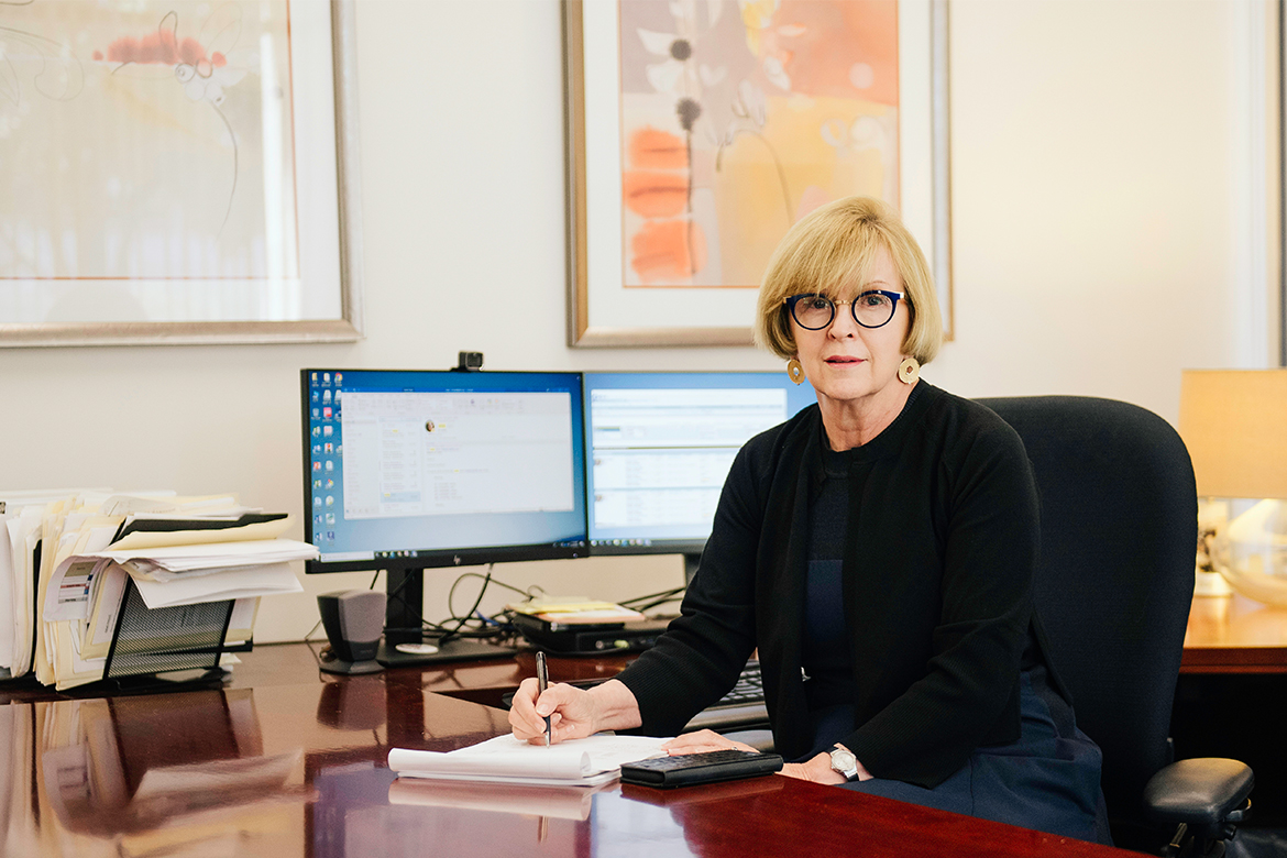 Photo of Cathrine Frank, MD sitting at a desk