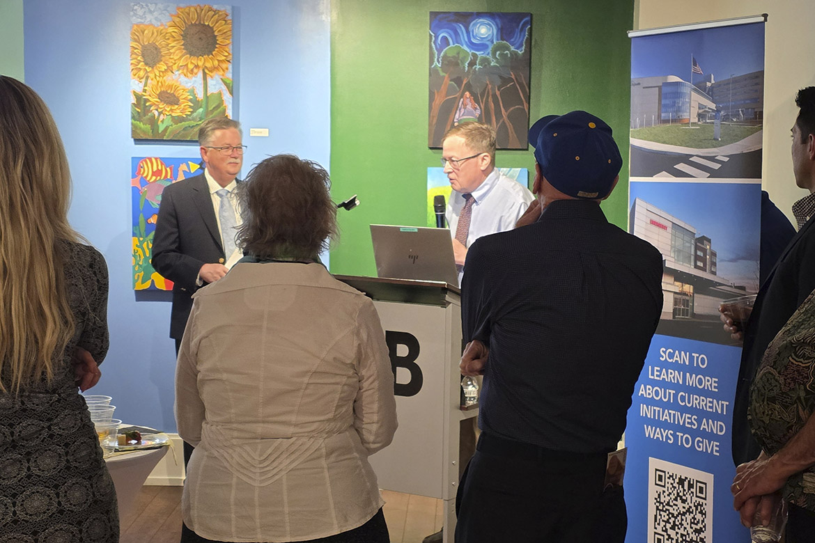 Thomas Vaughan, MD, delivers remarks at an art therapy reception