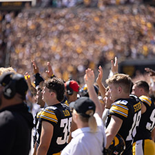 Hawkeye football players wave to patients in the pediatric hospital (Photo courtesy of University of Iowa)