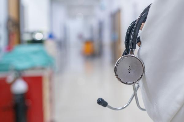 Physician holding a stethoscope