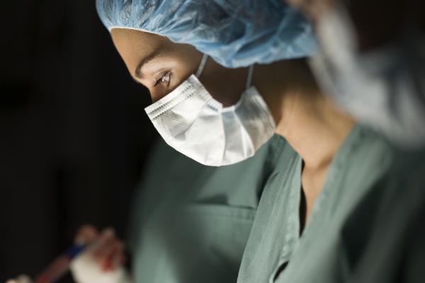 Female Medical Professional With Mask