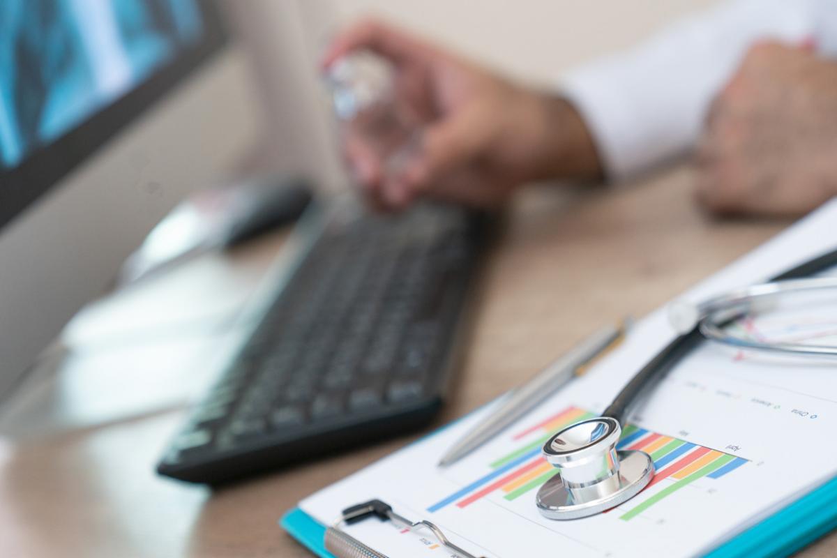 Doctor at computer keyboard