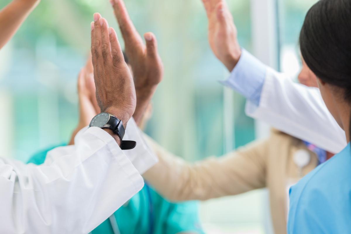 Medical professionals give high fives