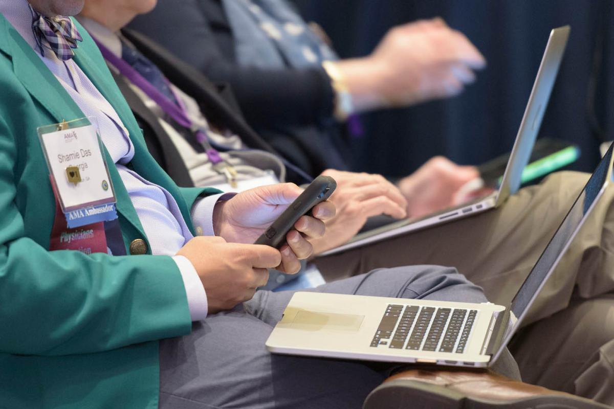 Working on a laptop during Interim Meeting