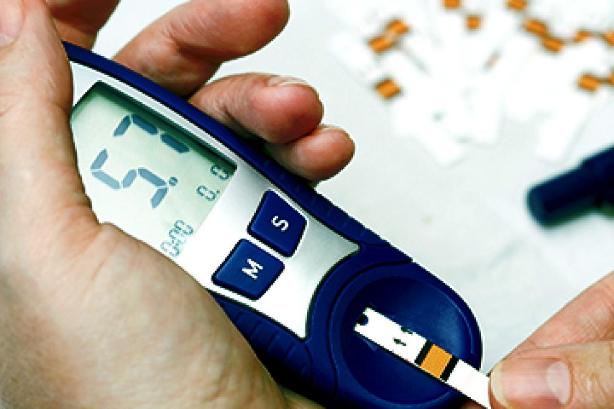 Person using a glucose monitor