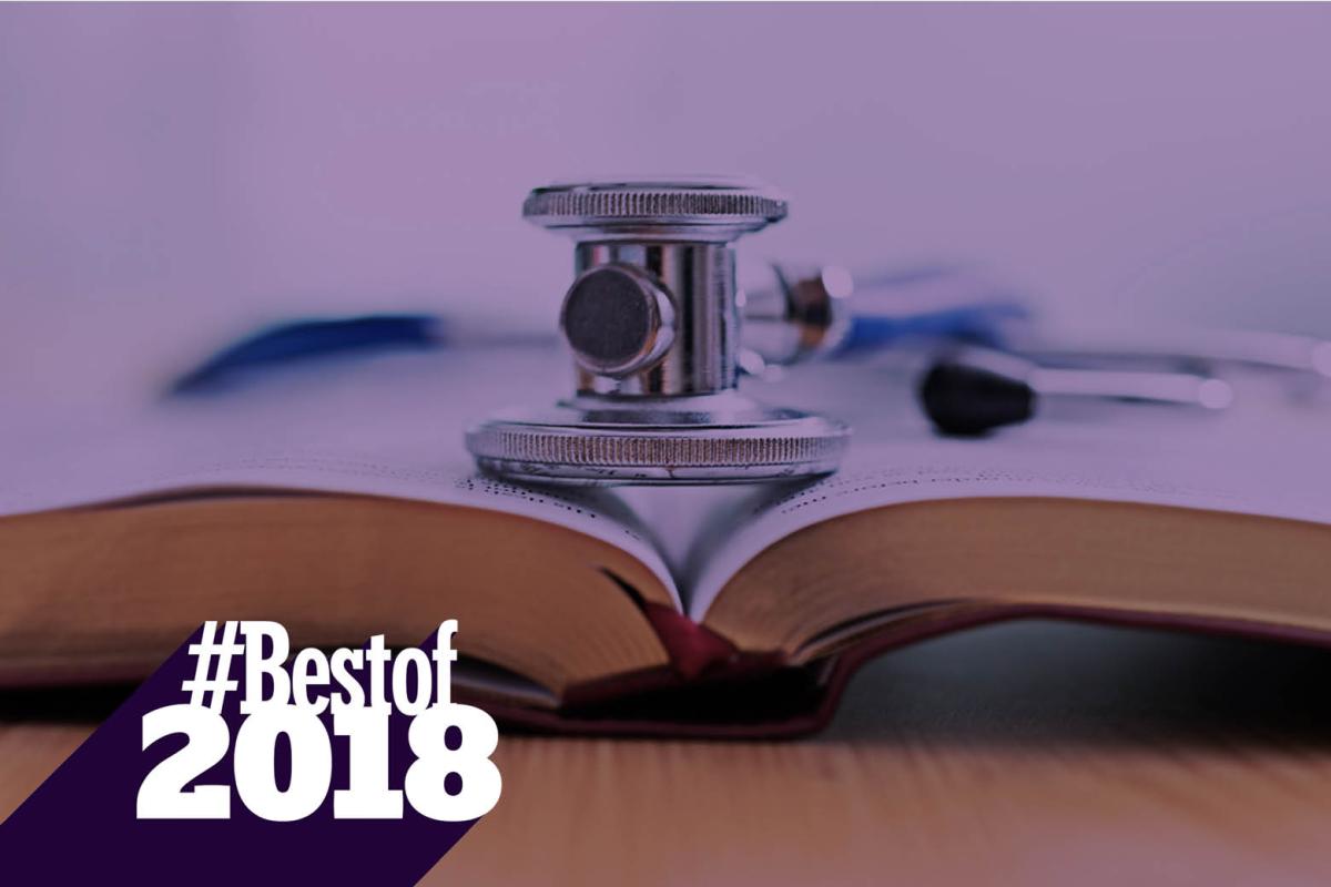 Stethoscope on top of open textbook