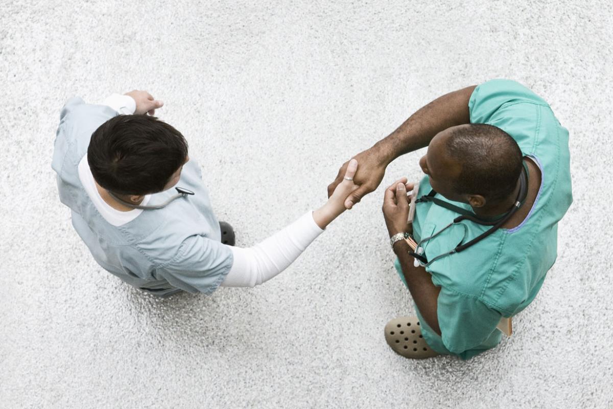 Two physicians shaking hands