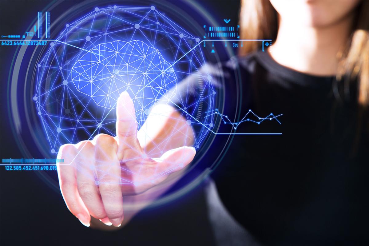 Woman points to augmented intelligence (AI) svcreen