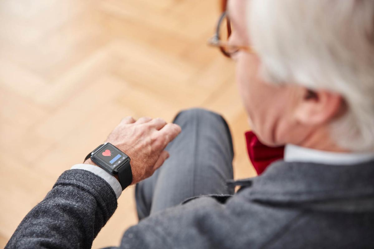 Man looking at wearable device