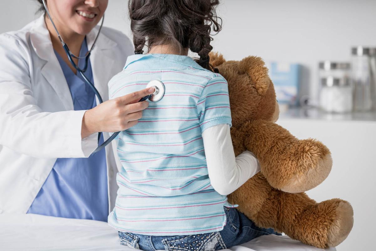 Physician with child patient