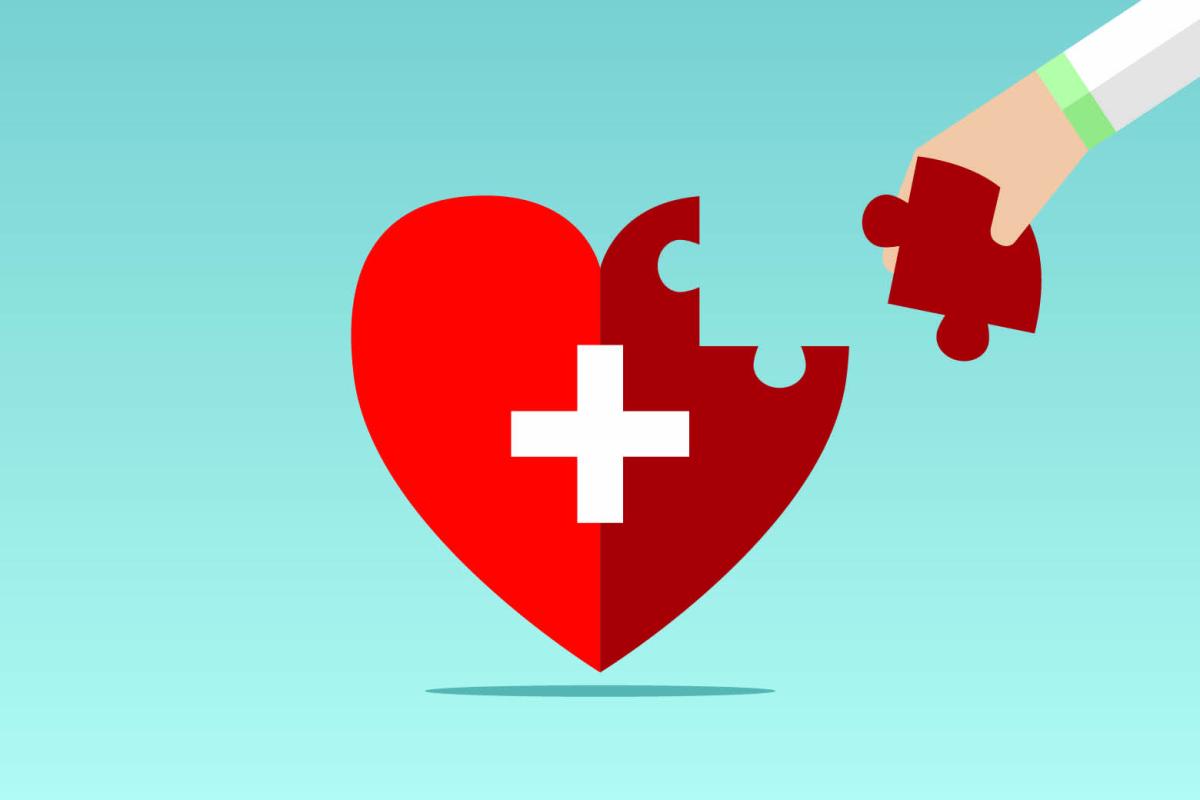 Heart-shaped puzzle with final piece being placed
