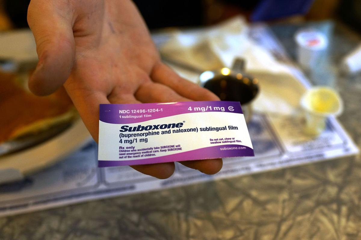 Hand holding medication label