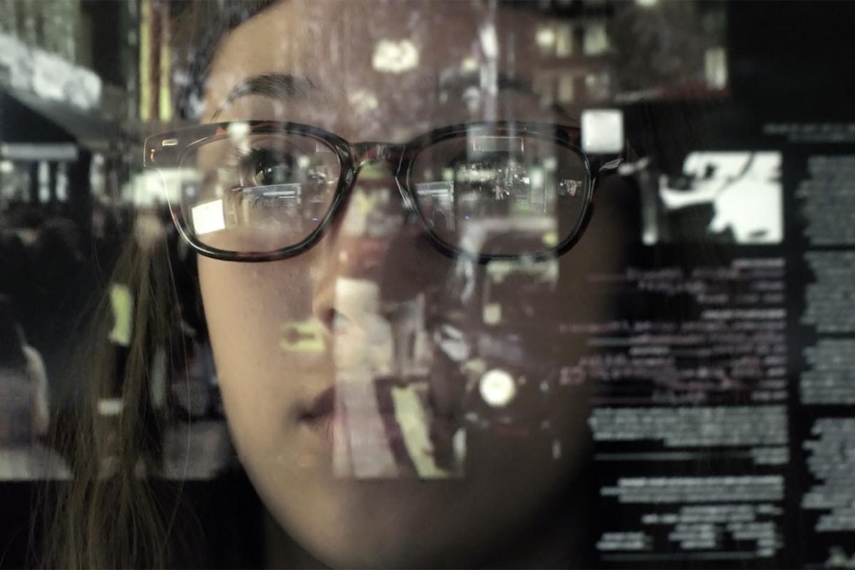 Woman looking through window 
