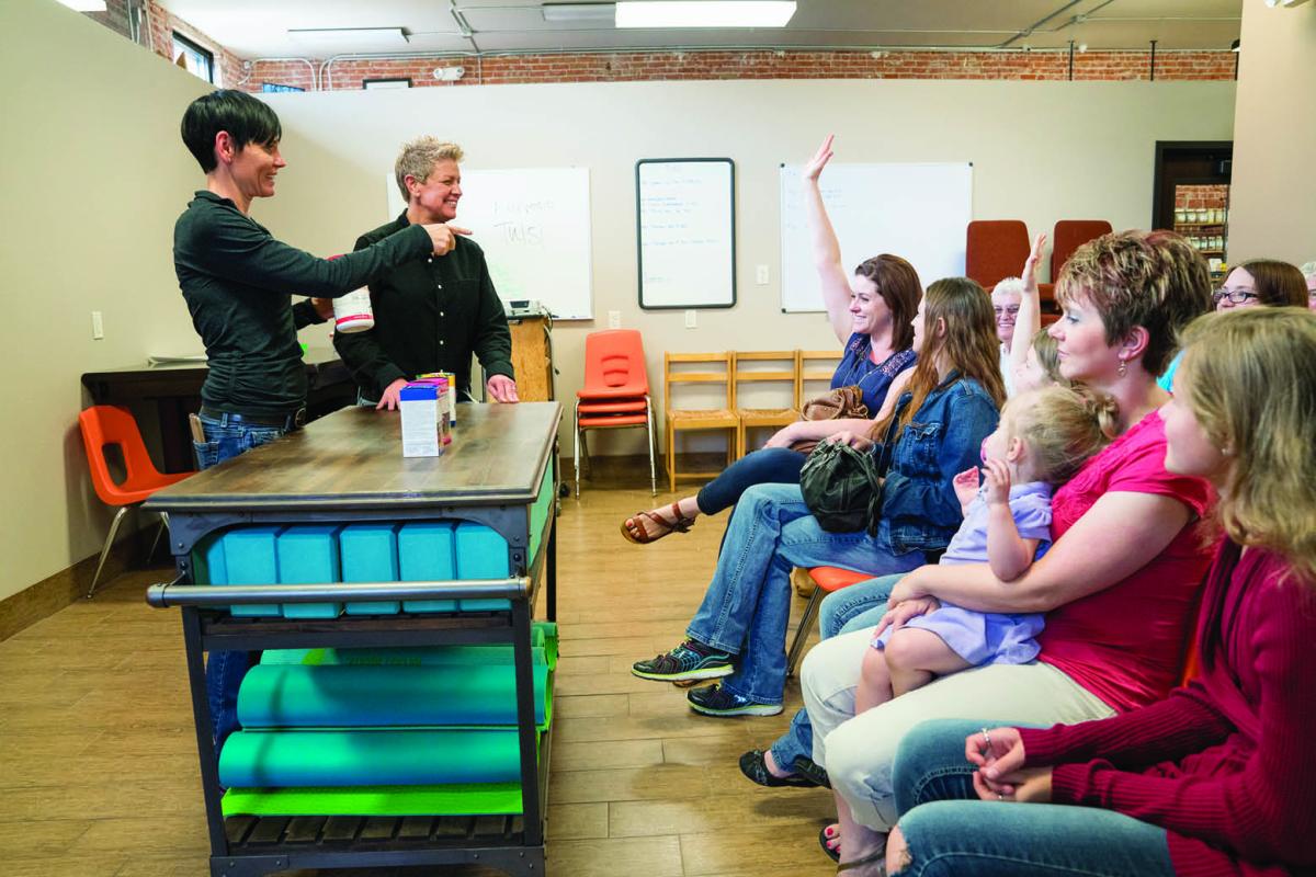 Two adults teaching a community nutrition class