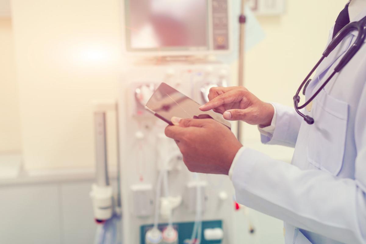 A physician using a tablet