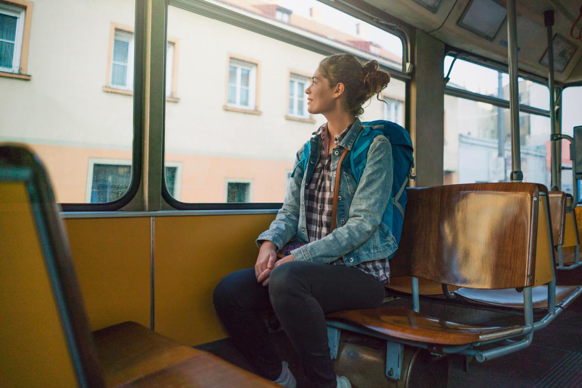 Woman on train looking out window