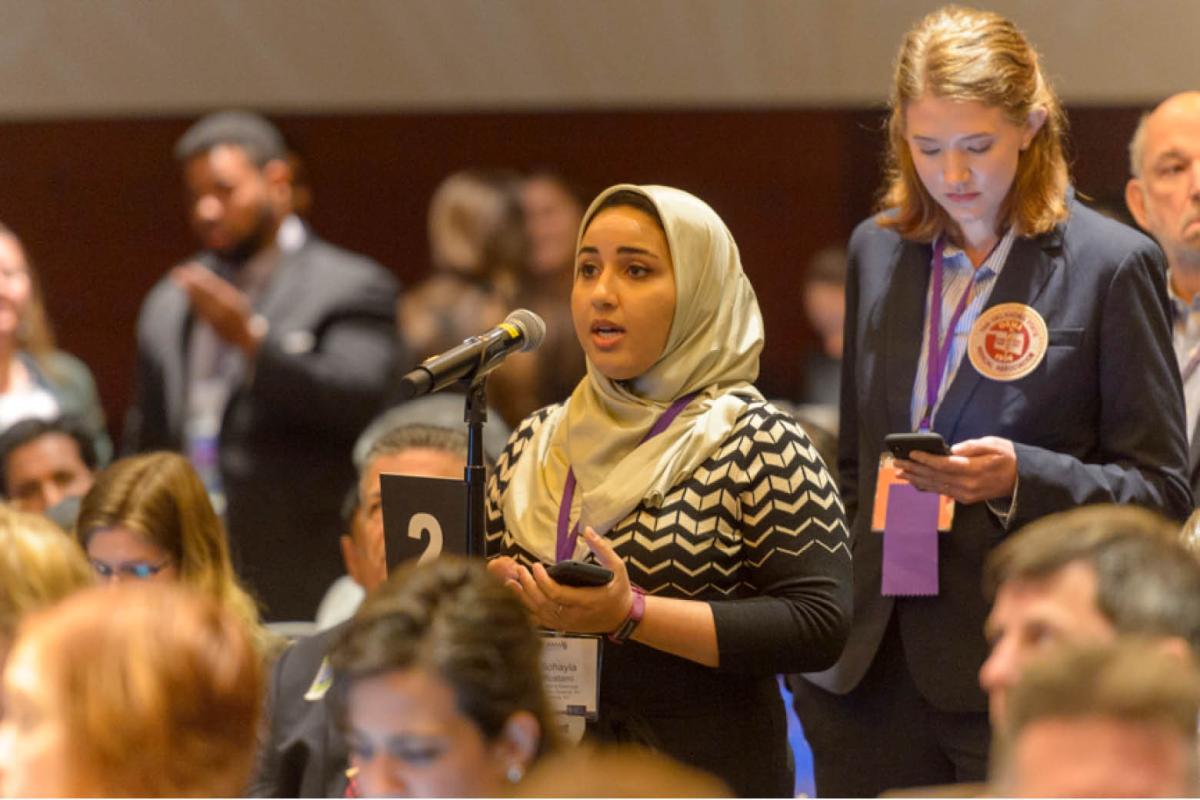 A woman speaking at the Annual Meeting of the AMA House of Delegates