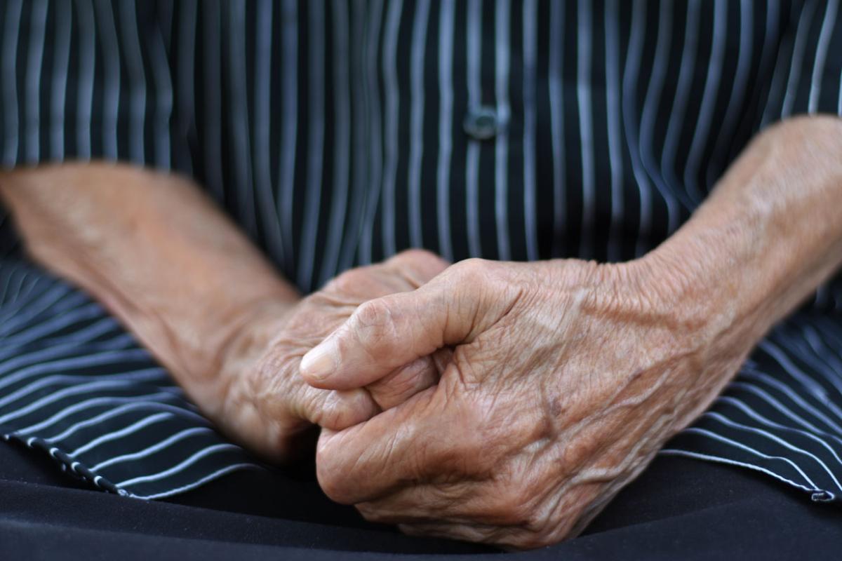 Elderly clasped hands