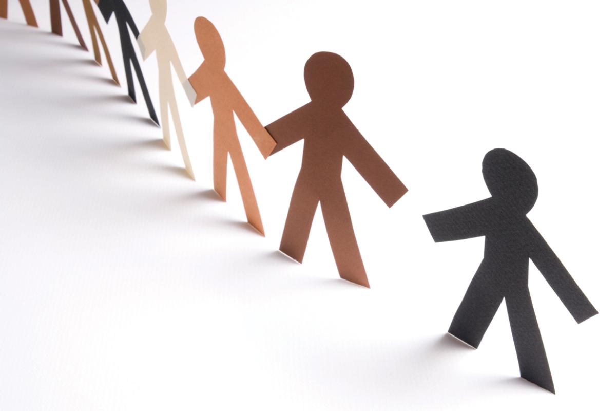 Paper doll cutouts in a line