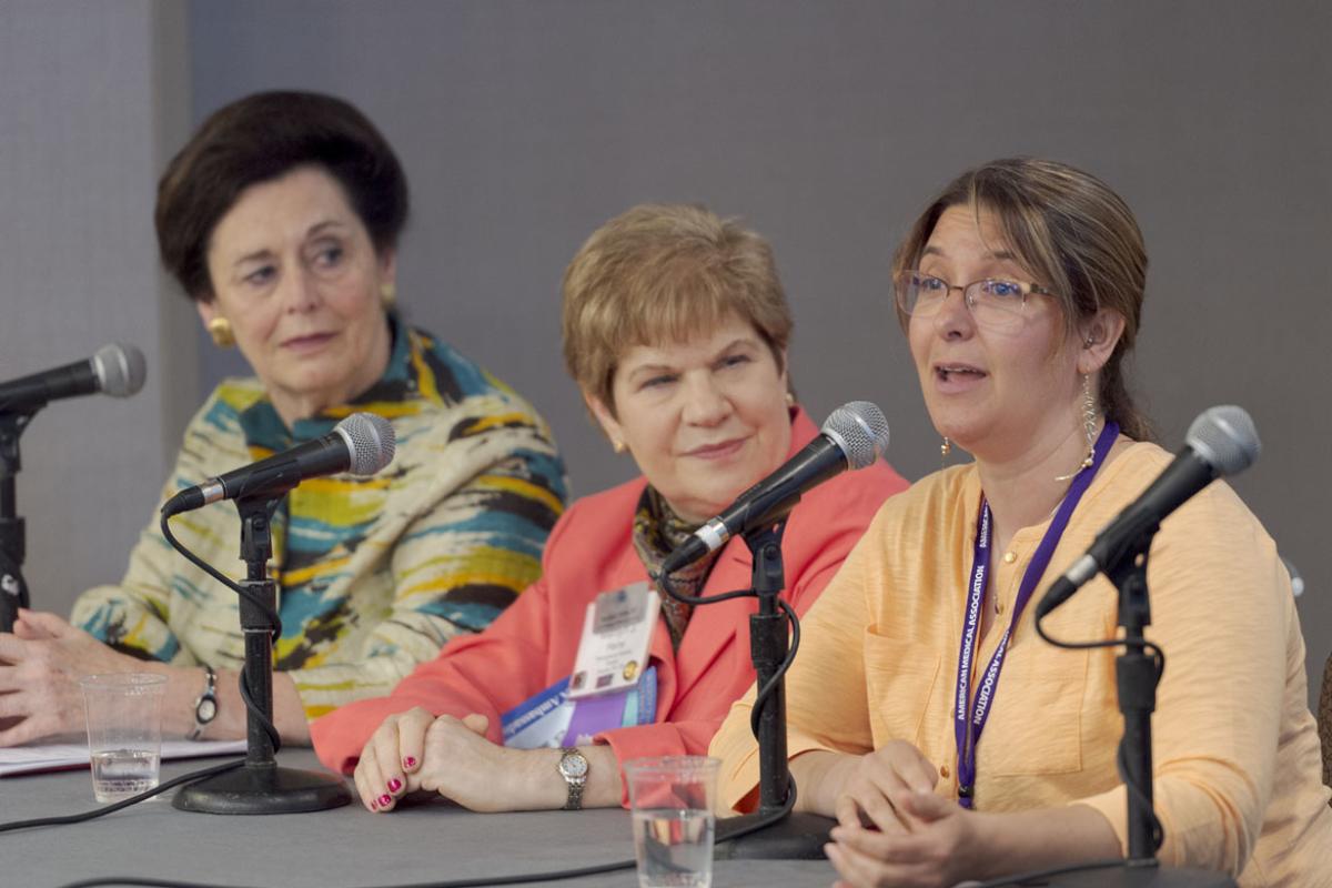 Three physicians speaking at an education session