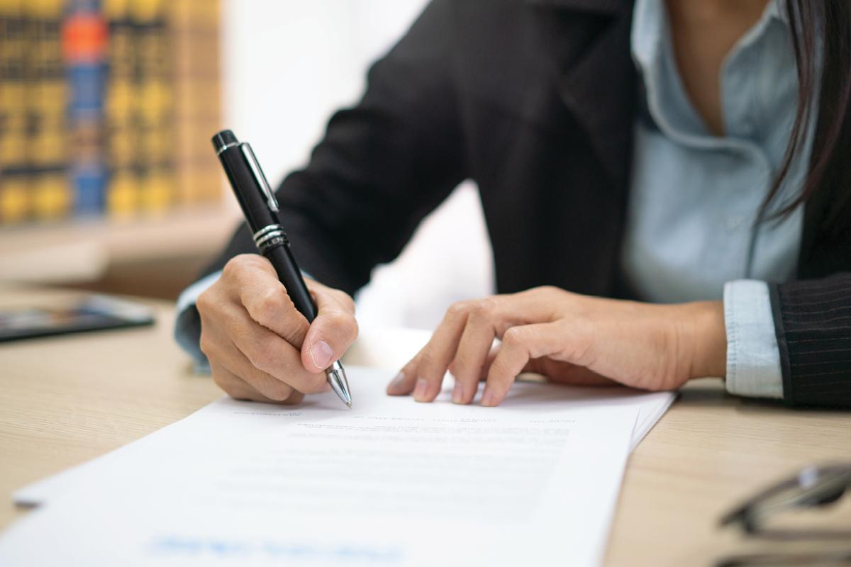 Person signing a contract