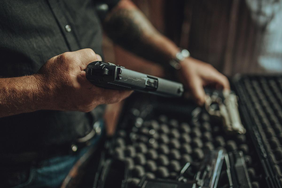 Hand holding a gun