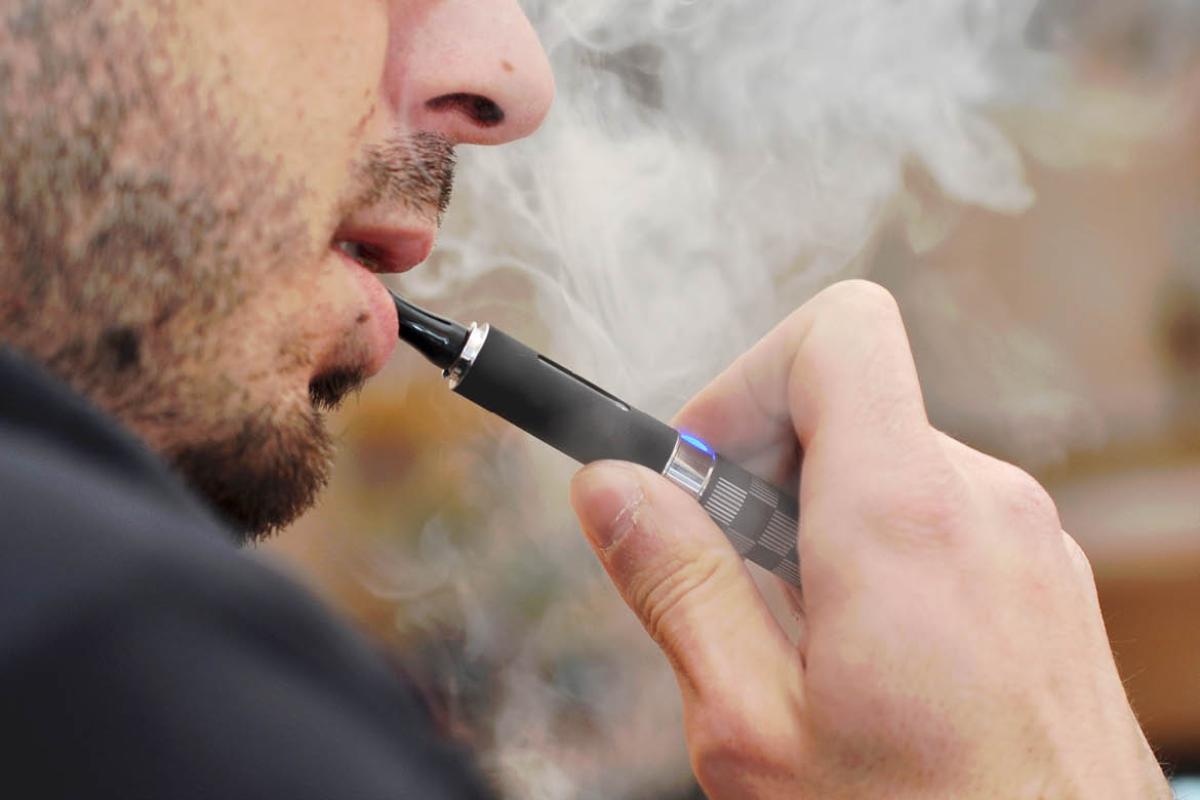 Person smoking an e-cigarette