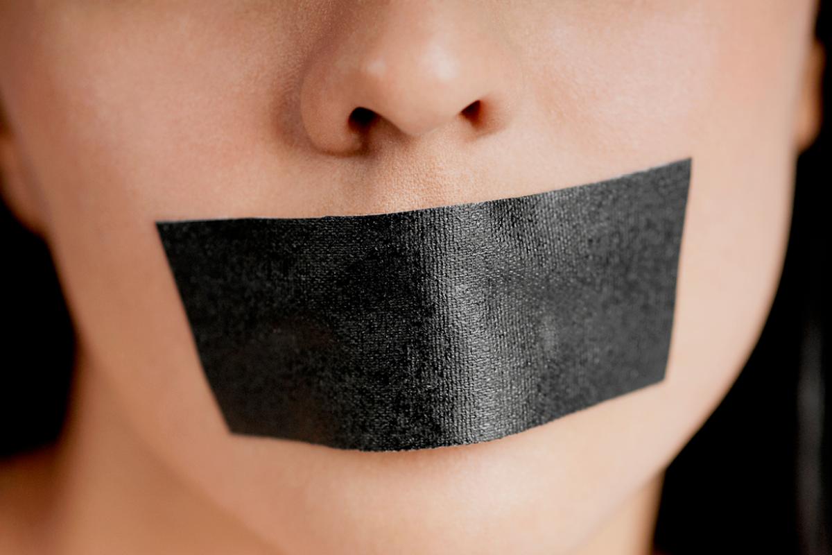 Person with tape over mouth
