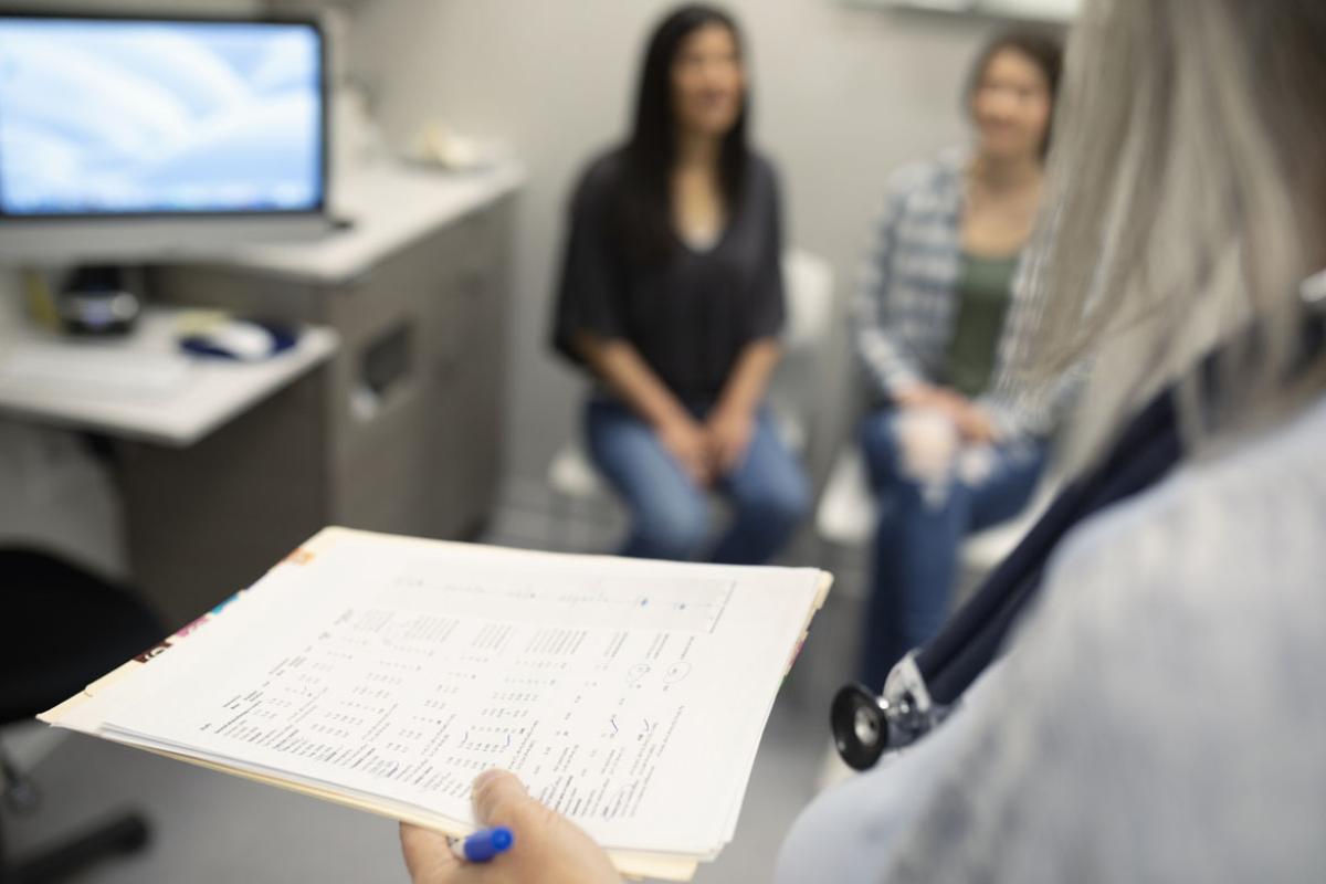 Physician speaking with patient