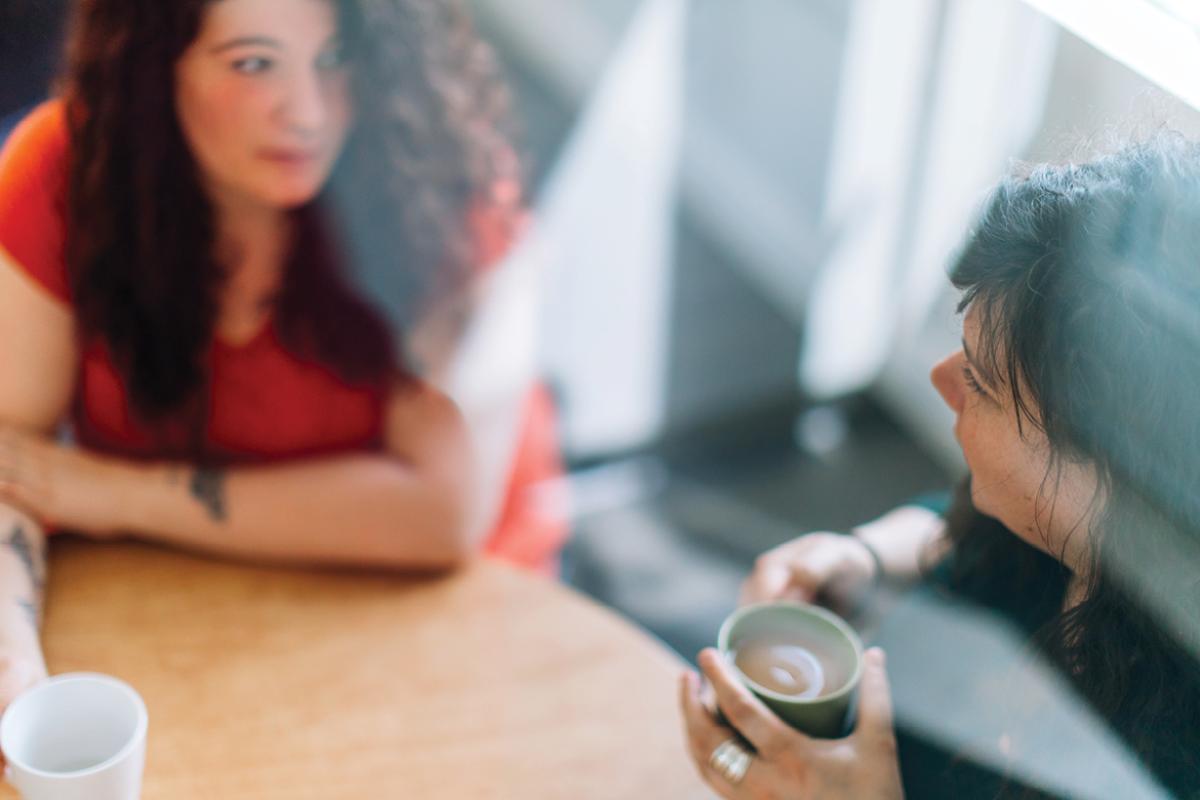 Two women drinking coffee