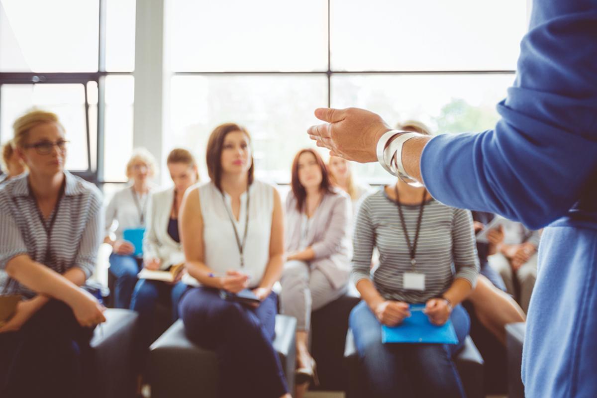 Person speaking in front of group