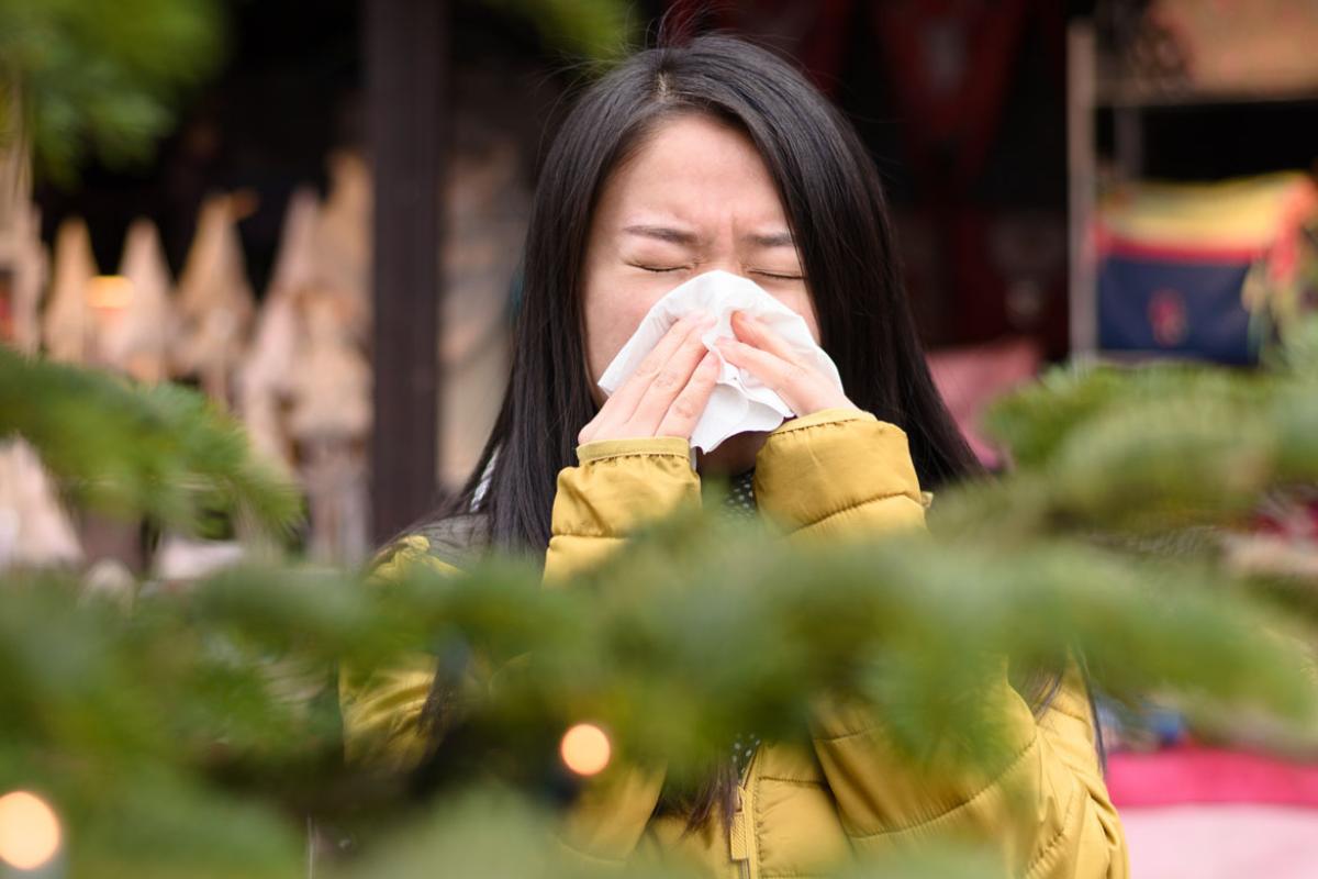 Woman sneezing