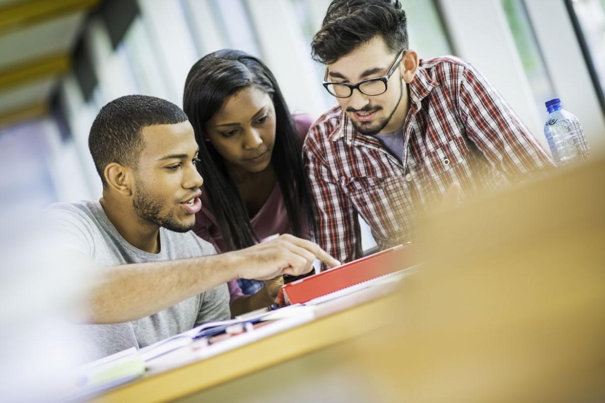 Students looking at a tablet