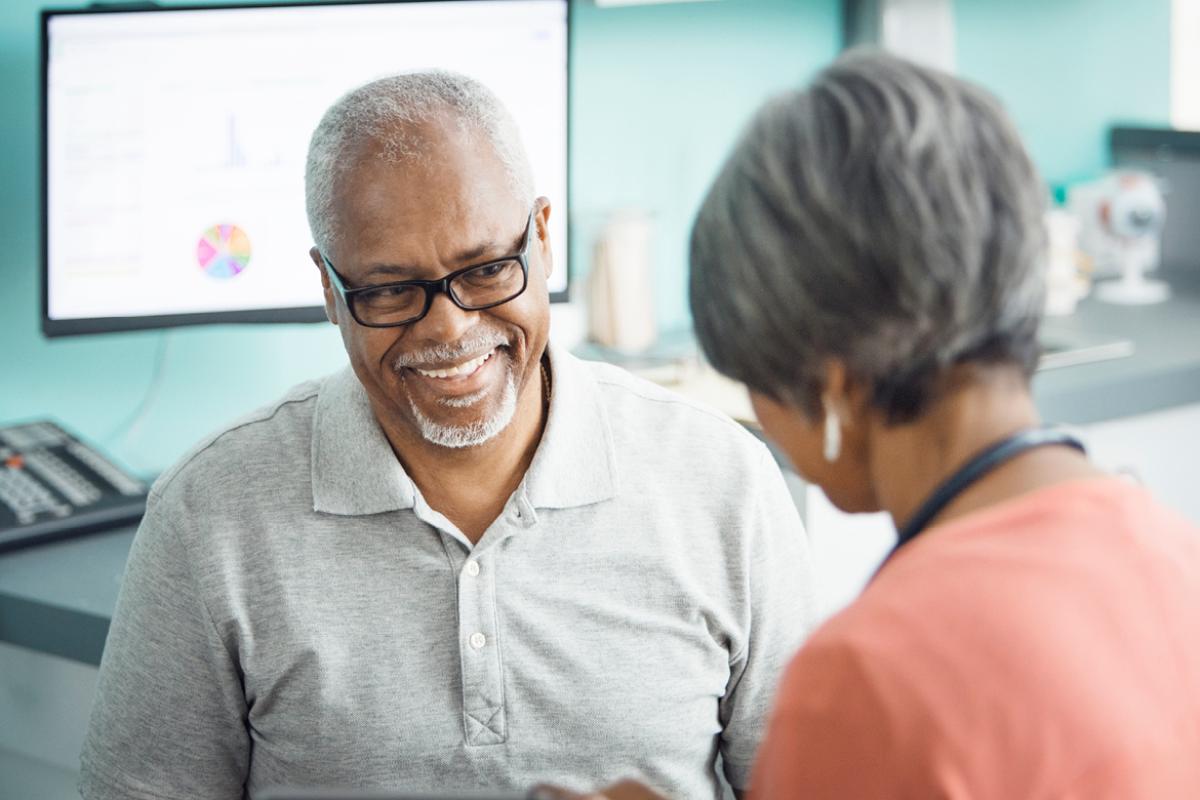 Man talking with physician