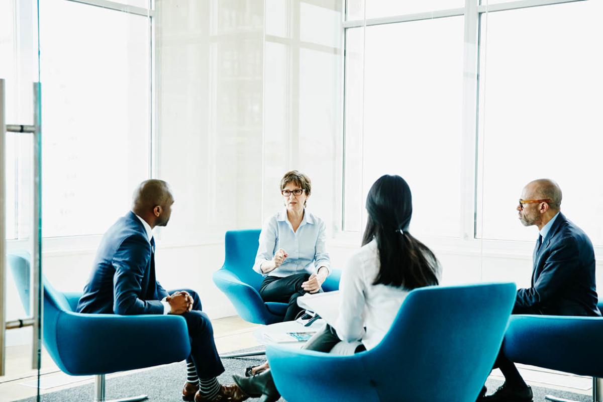 People in a circle speaking with one another