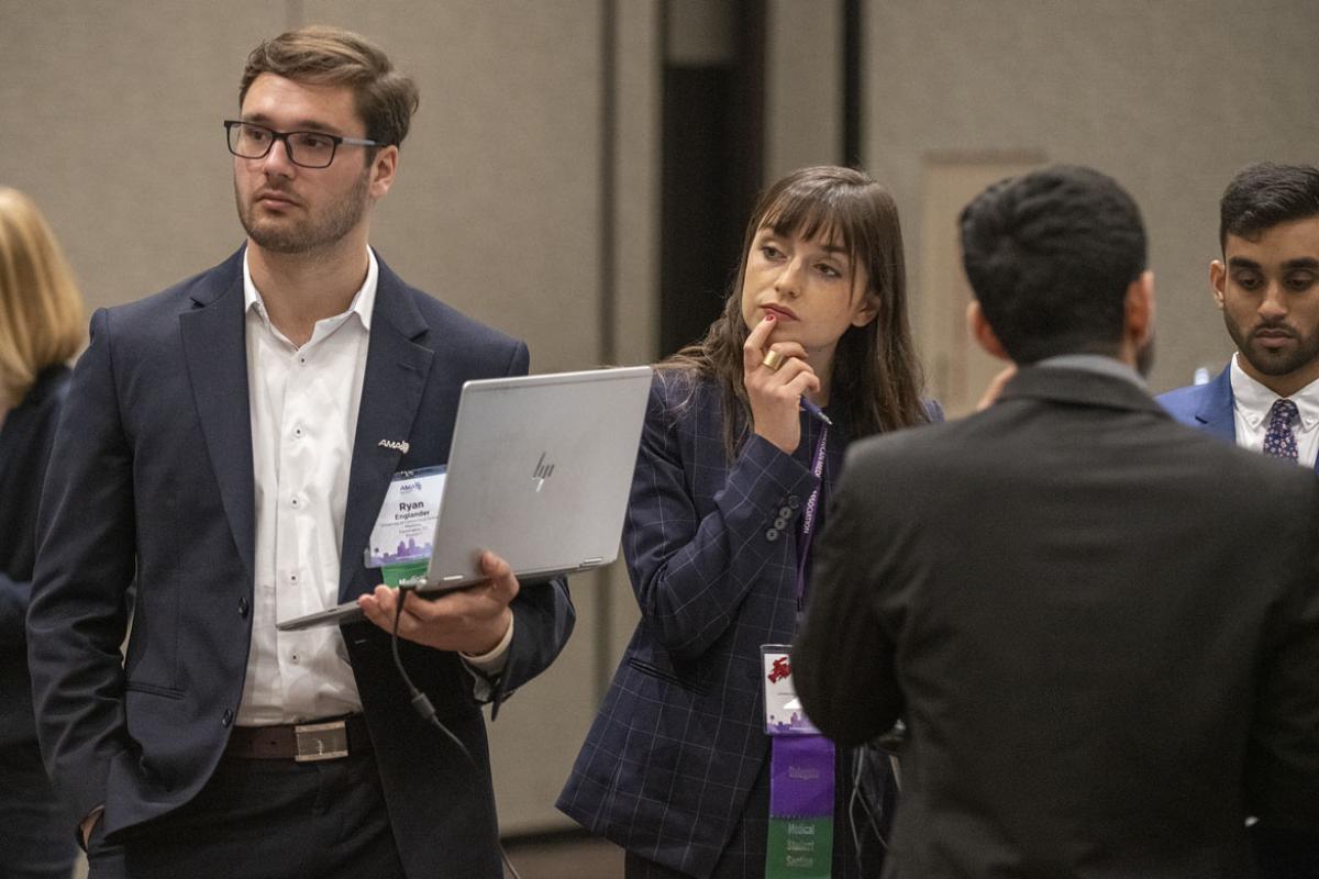 Group of delegates listening during the 2019 HOD Interim Meeting