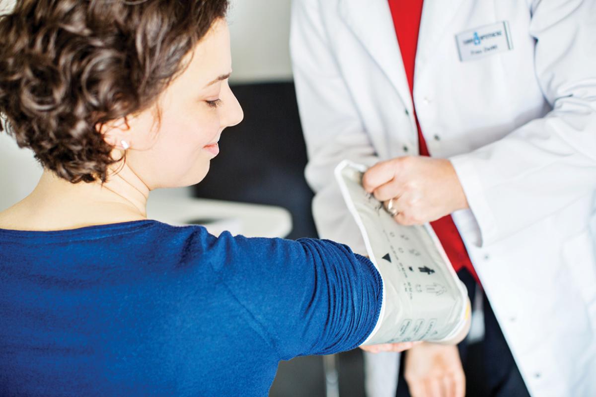 Patient having blood pressure measured