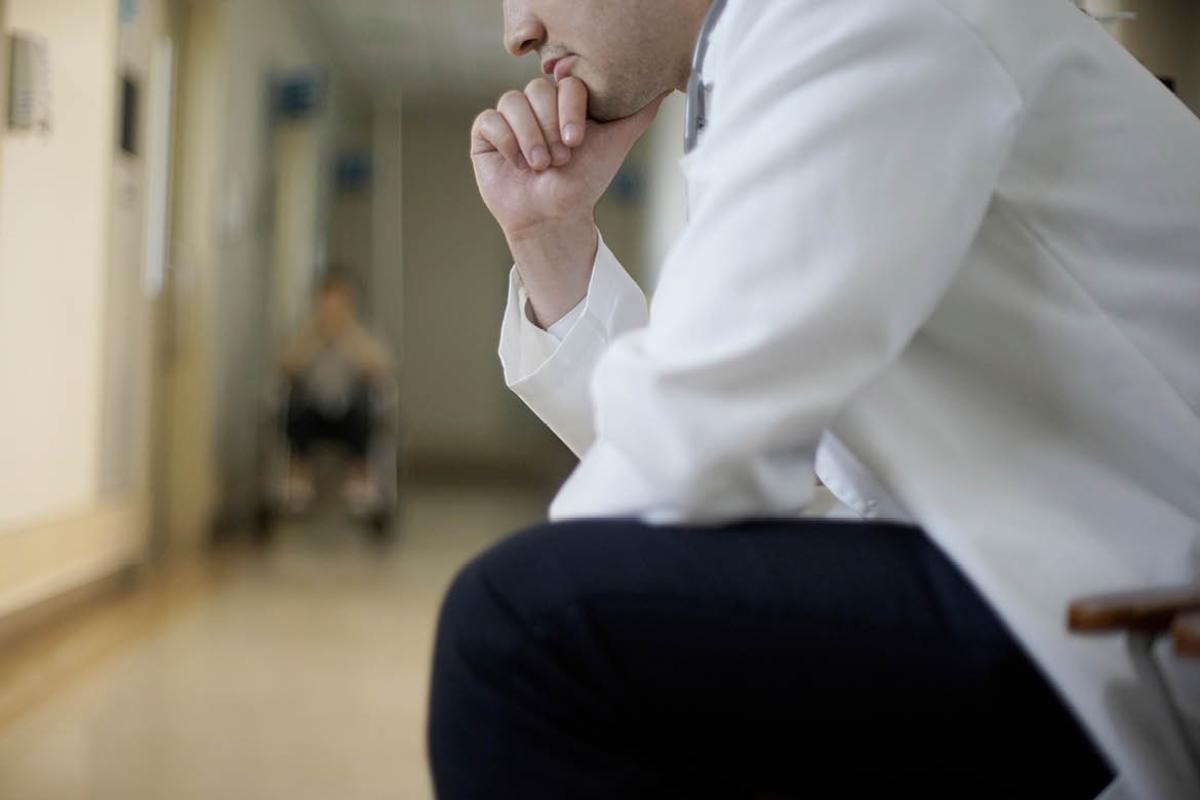Physician sit down and thinking