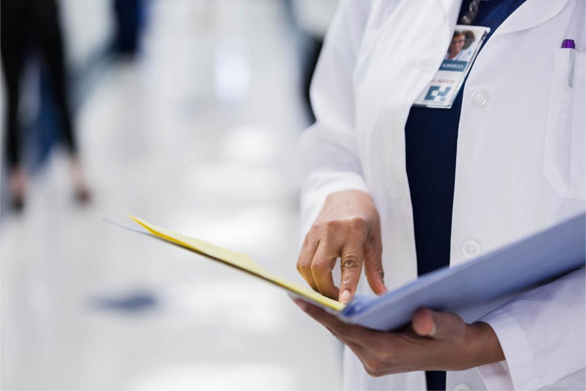 Physician looking at file