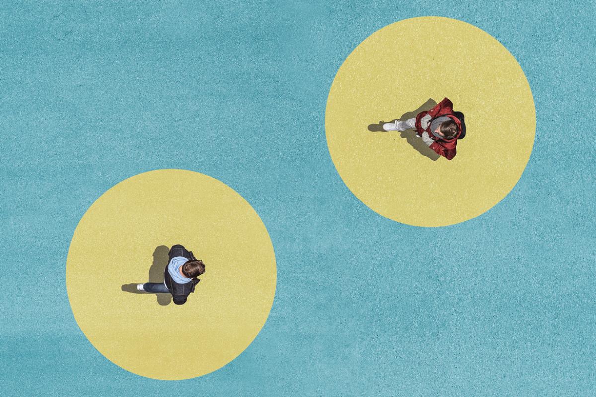 Overhead shot of two individuals walking toward one another at a distance