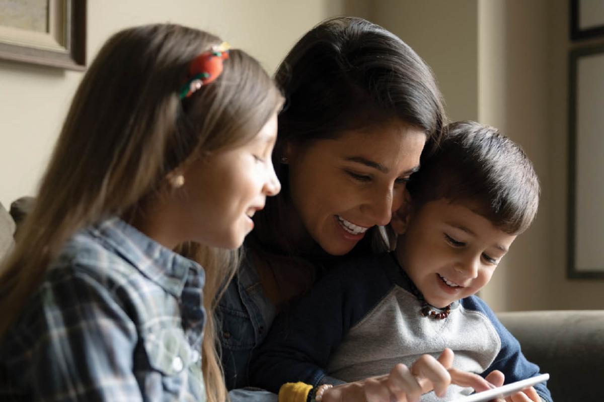 Smiling woman and young children