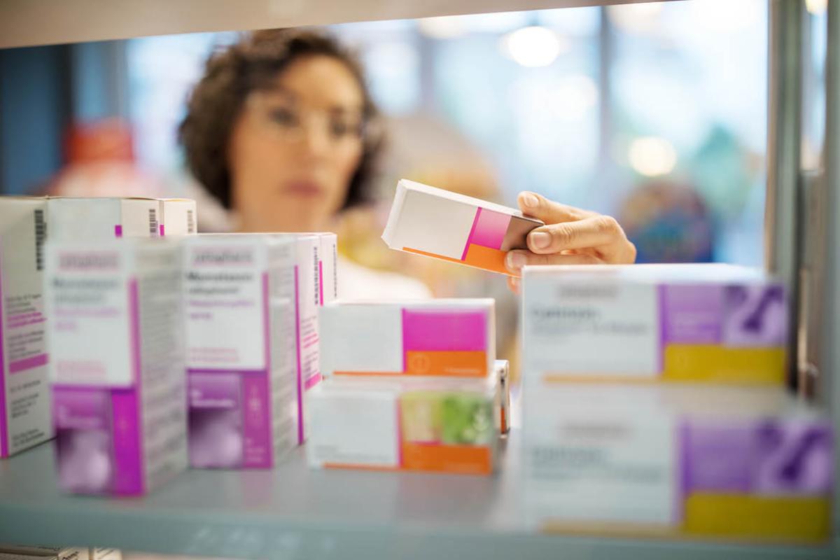 Person holding prescription medication box