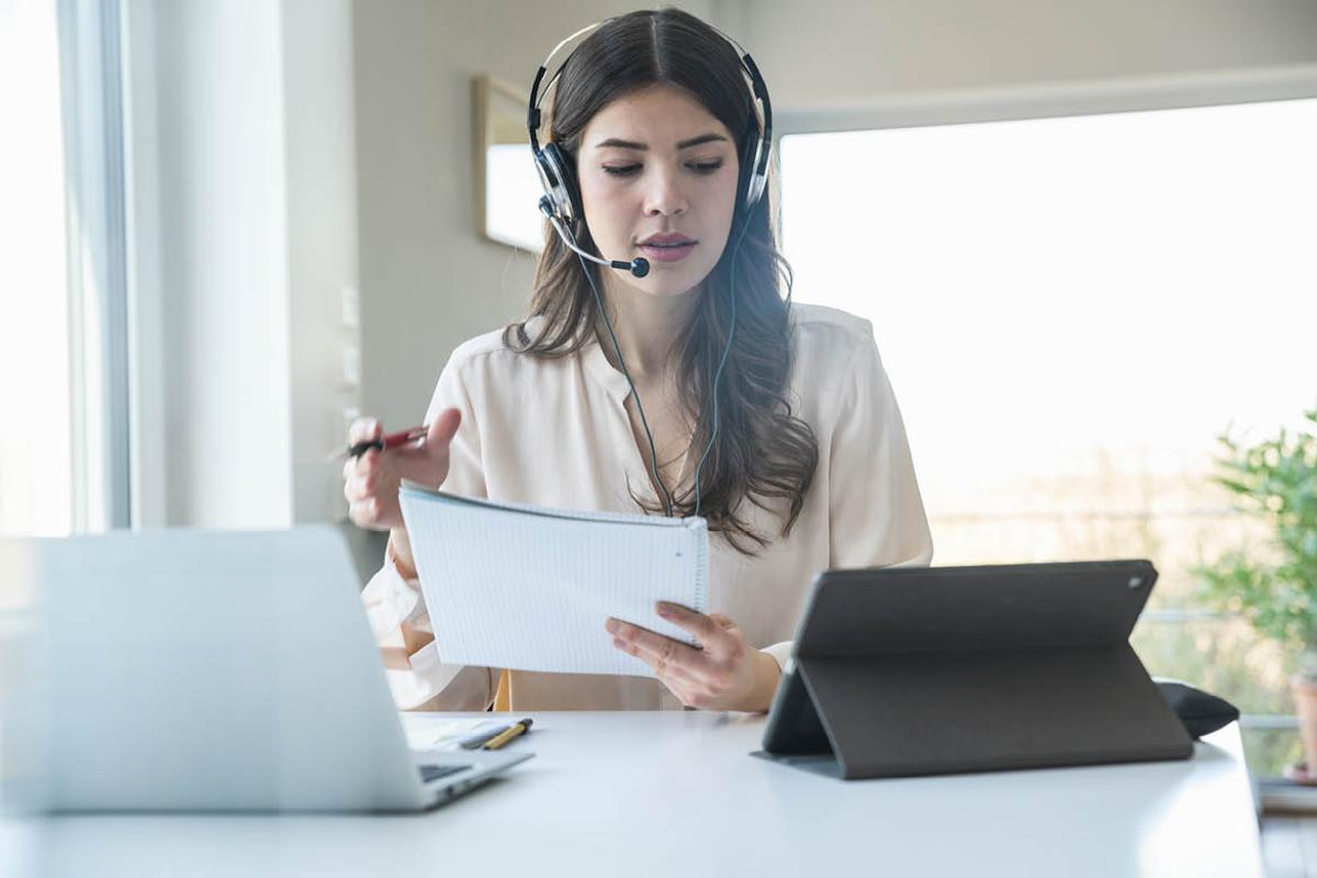 Woman using a telephone headset