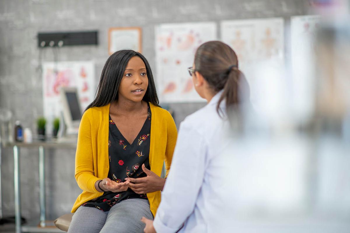 Woman speaking with physician
