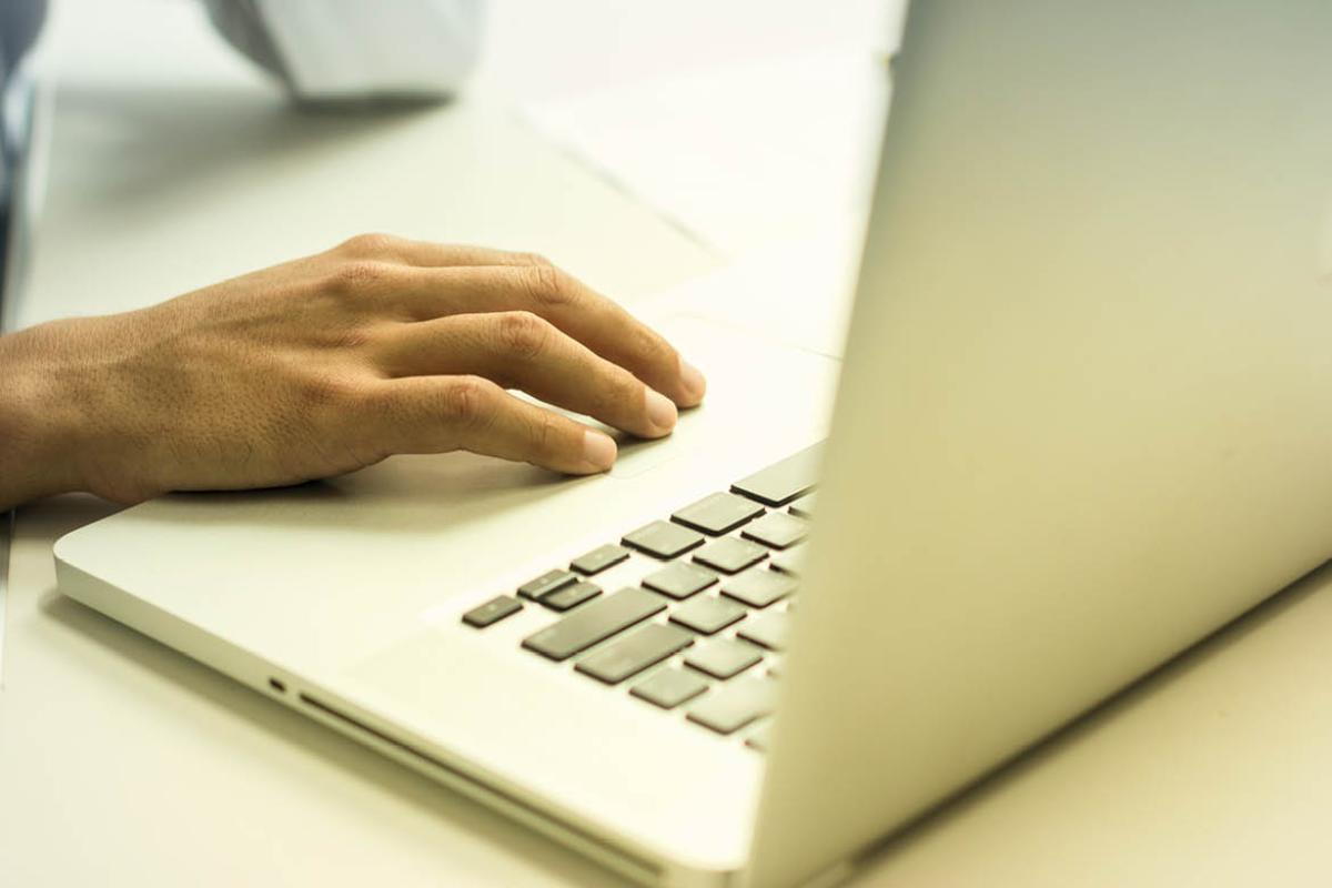 Hand on a laptop
