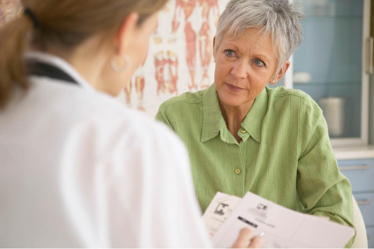 Woman speaking with physician