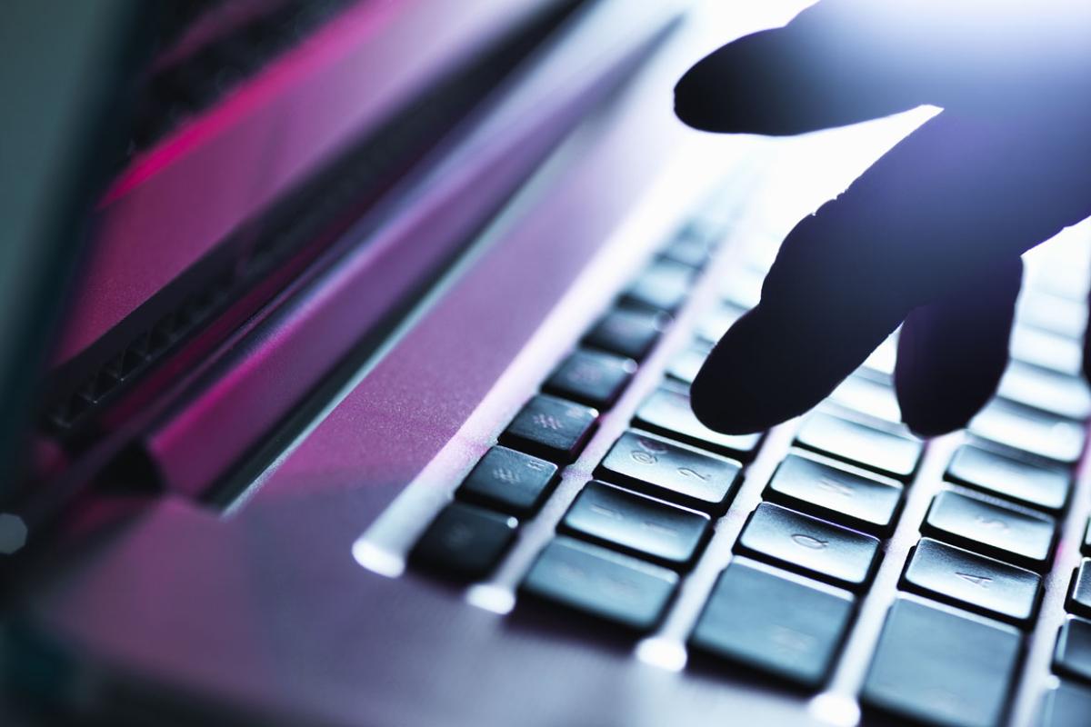 Fingers on laptop