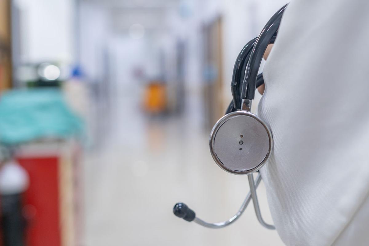 Physician holding stethoscope